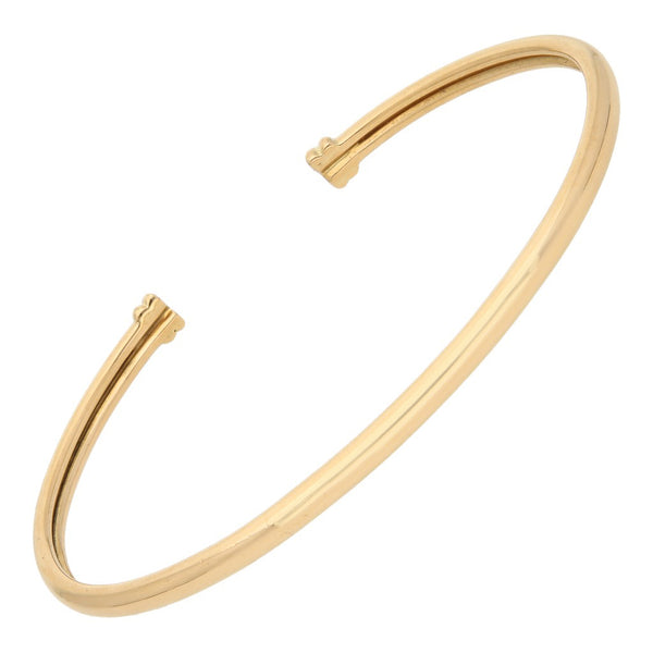 Pulsera de arillo abierta firma Tane en oro amarillo 18 kilates.