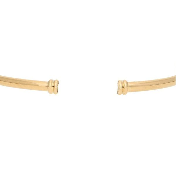 Pulsera de arillo abierta firma Tane en oro amarillo 18 kilates.