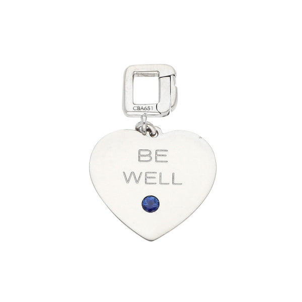 Dije diseño especial motivo corazón con esmalte,zafiro,aplicación motivo león firma Louis Vuitton en oro blanco 18 kilates.