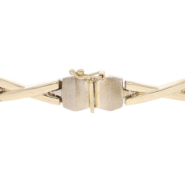 Pulsera eslabón XOXO en oro dos tonos 14 kilates.