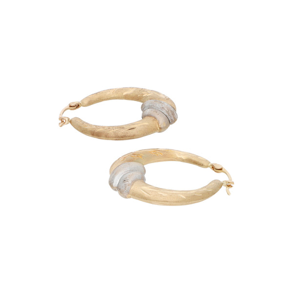 Arracadas labradas platinadas en oro amarillo 14 kilates.