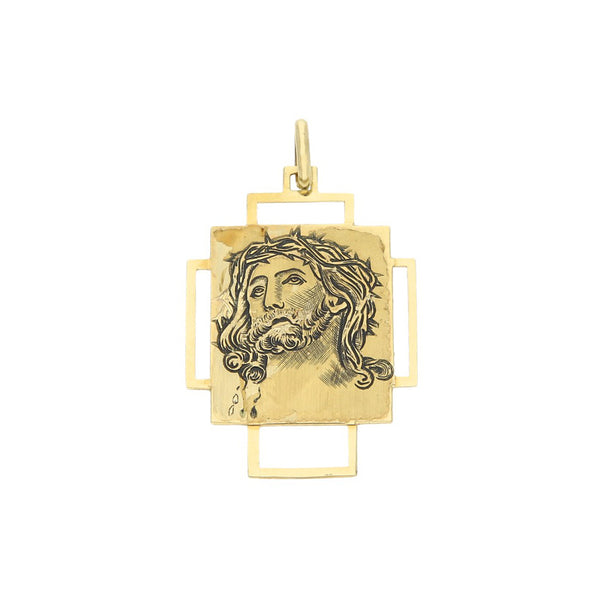 Medalla calada motivo Cristo en oro amarillo 14 kilates.