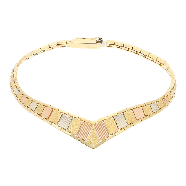 Pulsera eslabón articulado en oro tres tonos 14 kilates.