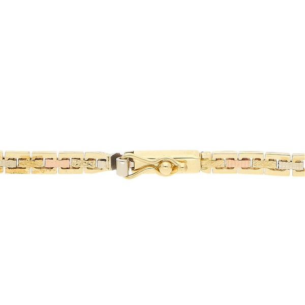 Pulsera eslabón articulado en oro tres tonos 14 kilates.