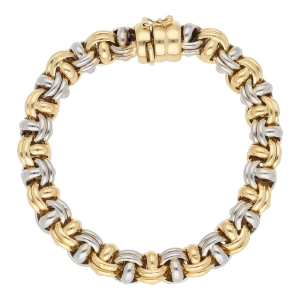 Pulsera eslabón tejido en oro dos tonos 18 kilates.