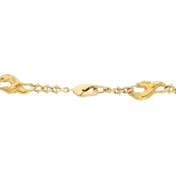 Pulsera eslabón encontrado con aplicaciones motivo caballo firma Carrera y Carrera en oro amarillo 18 kilates.