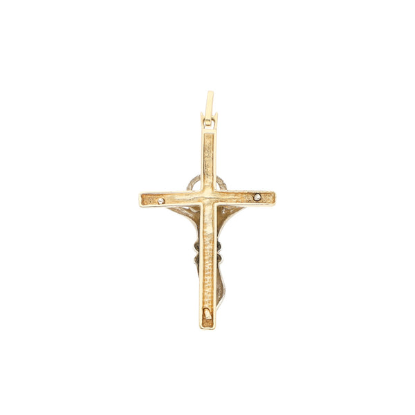 Crucifijo estilizado en oro dos tonos 14 kilates.