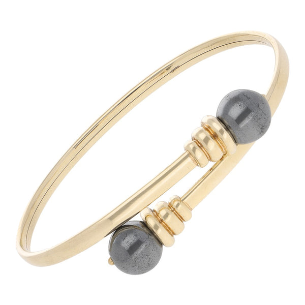 Pulsera de arillo abierta con perlas en oro amarillo 14 kilates.