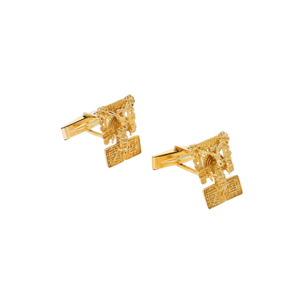 Mancuernillas caladas motivo figura pre hispánica en oro amarillo 14 kilates.