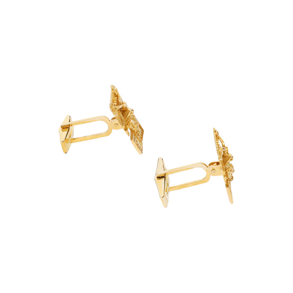 Mancuernillas caladas motivo figura pre hispánica en oro amarillo 14 kilates.