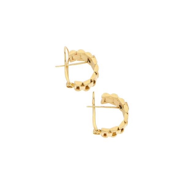 Aretes diseño especial en oro amarillo 14 kilates.