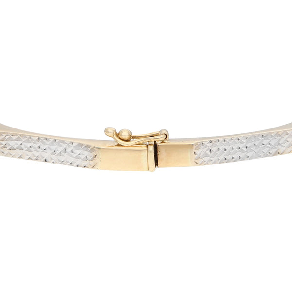 Pulsera de arillo articulada en oro dos tonos 14 kilates.