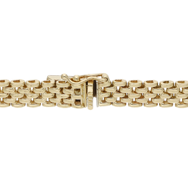 Pulsera eslabón articulado con aplicaciones de diamantes en oro dos tonos 14 kilates.