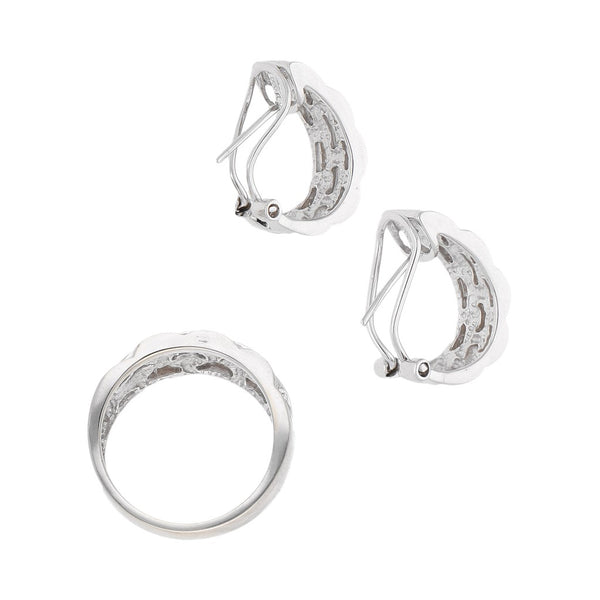 Juego de anillo y aretes diseño especial con diamantes en oro blanco 14 kilates.