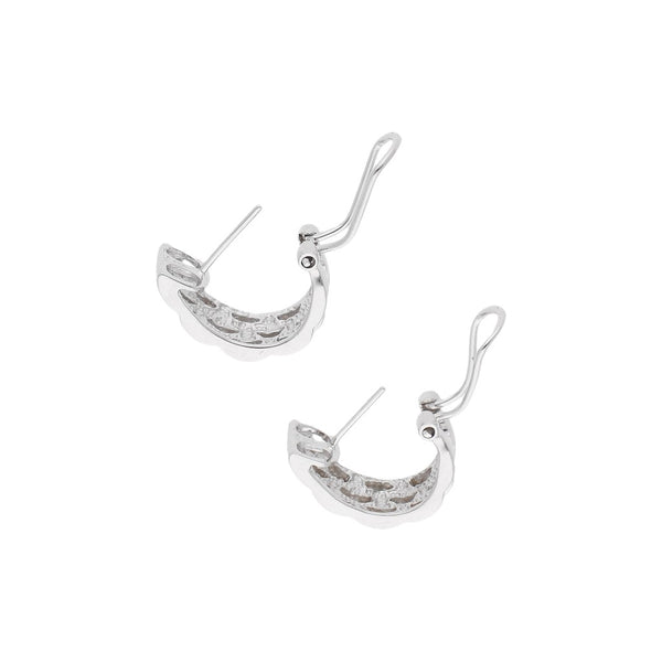 Juego de anillo y aretes diseño especial con diamantes en oro blanco 14 kilates.