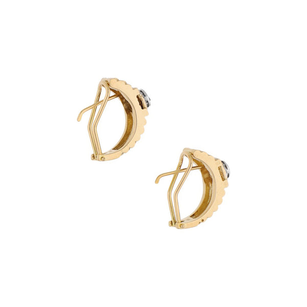 Aretes diseño especial con diamantes en oro amarillo 18 kilates.