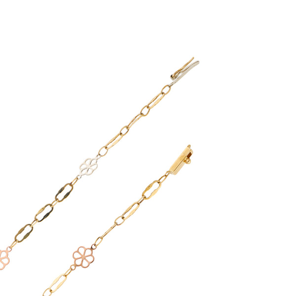 Collar eslabón combinado con aplicaciones motivo flor en oro tres tonos 14 kilates.