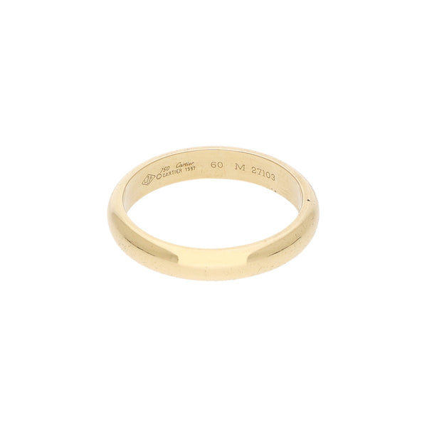 Argolla lisa firma Cartier en oro amarillo 18 kilates.