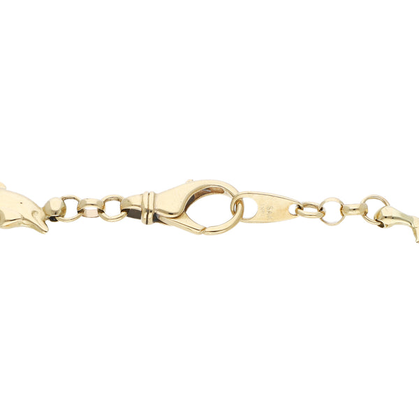 Pulsera eslabón combinado con aplicaciones motivo delfín en oro amarillo 14 kilates.