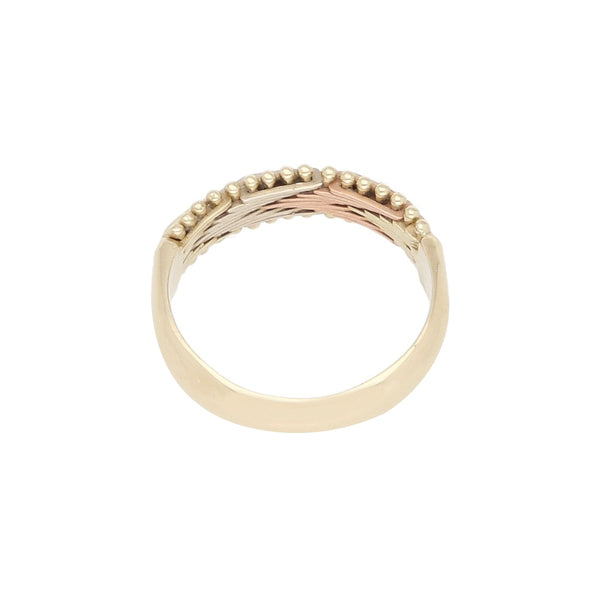 Anillo boleado en oro tres tonos 14 kilates.