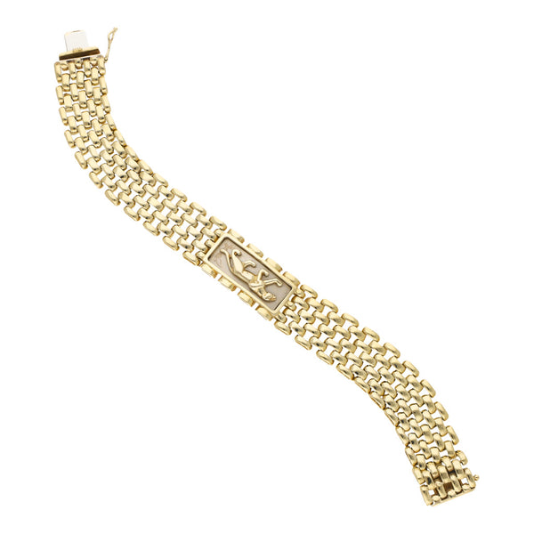 Pulsera eslabón articulado con aplicación motivo pantera en oro dos tonos 14 kilates.