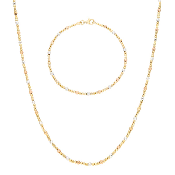 Juego de gargantilla y pulsera eslabón boleado en oro tres tonos 14 kilates.