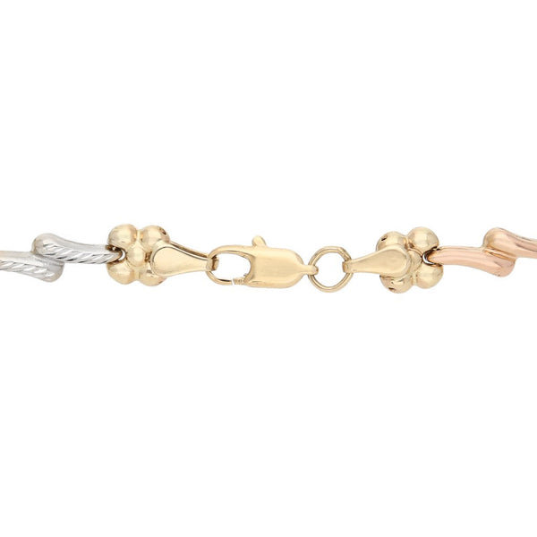 Pulsera eslabón articulado motivo flores en oro amarillo 14 kilates.