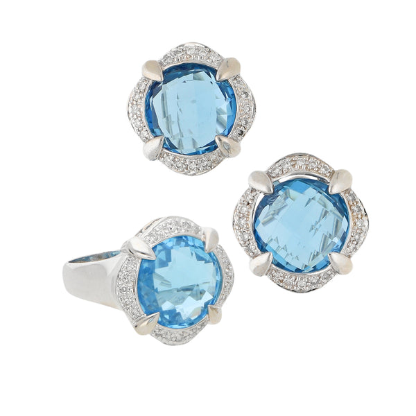 Juego de anillo y aretes diseño especial con diamantes y sintéticos en oro blanco 14 kilates.