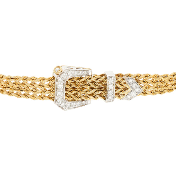 Pulsera eslabón trenzado motivo cinturón con diamantes en oro dos tonos 14 kilates.