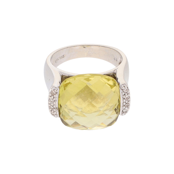 Anillo diseño especial con diamantes y sintético en oro blanco 14 kilates.