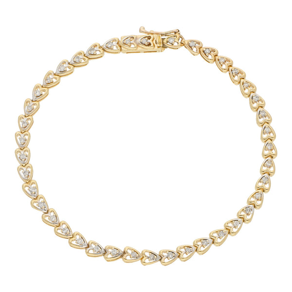 Pulsera eslabón articulado motivo corazones con diamantes en oro amarillo 14 kilates.