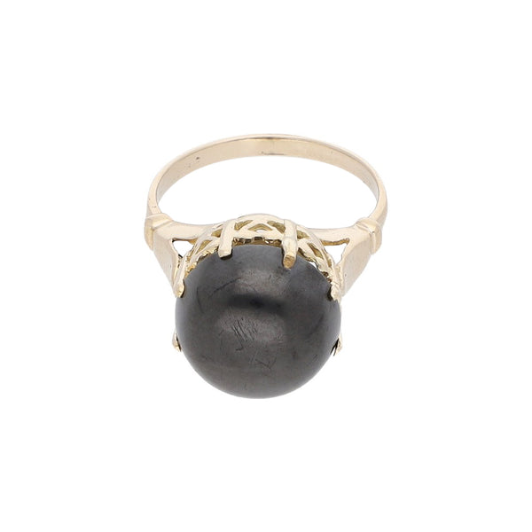 Anillo diseño especial con sintético en oro amarillo 12 kilates.