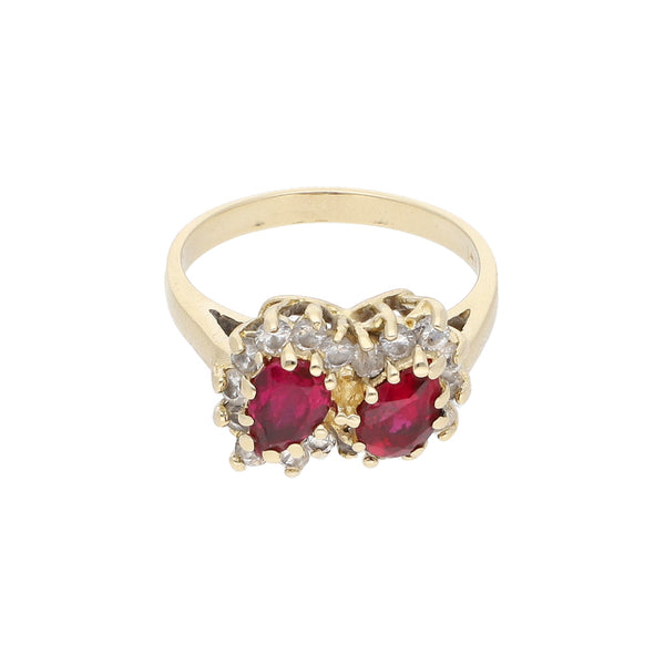 Anillo diseño especial con sintéticos en oro amarillo 14 kilates.
