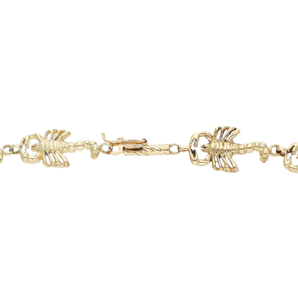 Pulsera eslabón articulado motivo escorpiones en oro amarillo 14 kilates.