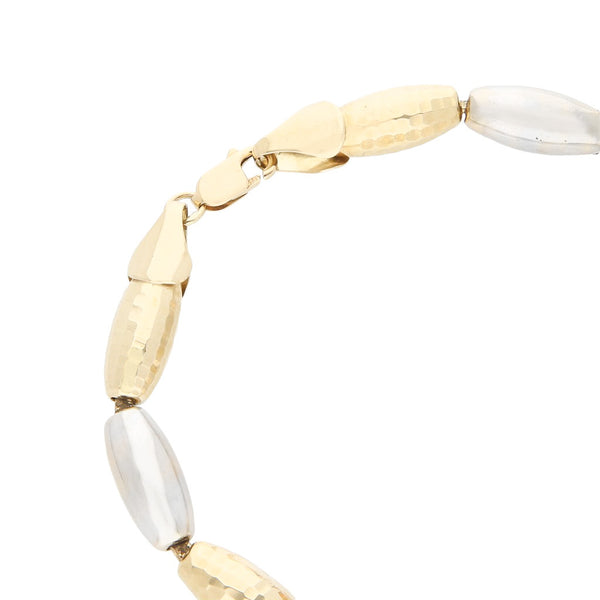 Pulsera eslabón hueco en oro dos tonos 14 kilates.