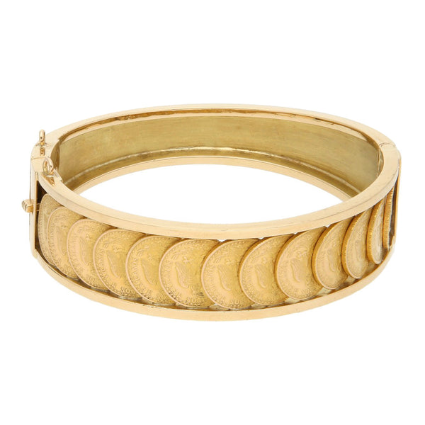 Pulsera de arillo articulada con trece monedas de dos pesos oro mexicano 21.6 kilates en oro amarillo 18 kilates.