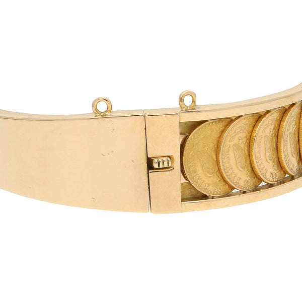Pulsera de arillo articulada con trece monedas de dos pesos oro mexicano 21.6 kilates en oro amarillo 18 kilates.