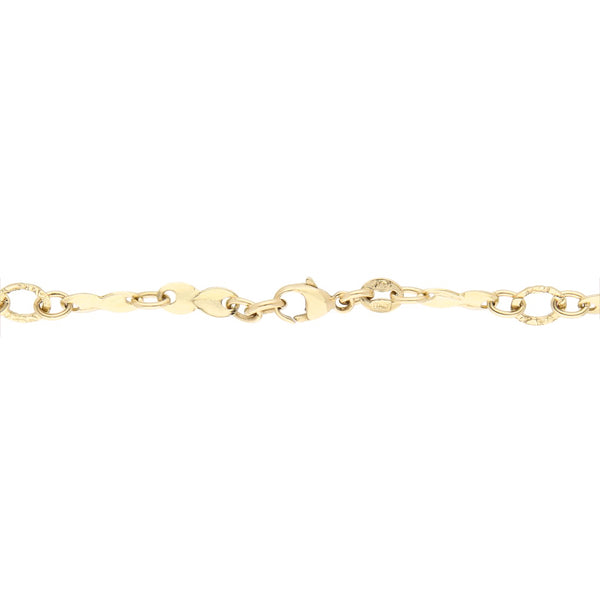 Pulsera eslabón combinado con aplicación motivo corazón en oro amarillo 14 kilates.
