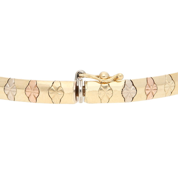 Pulsera eslabón articulado en oro tres tonos 14 kilates.