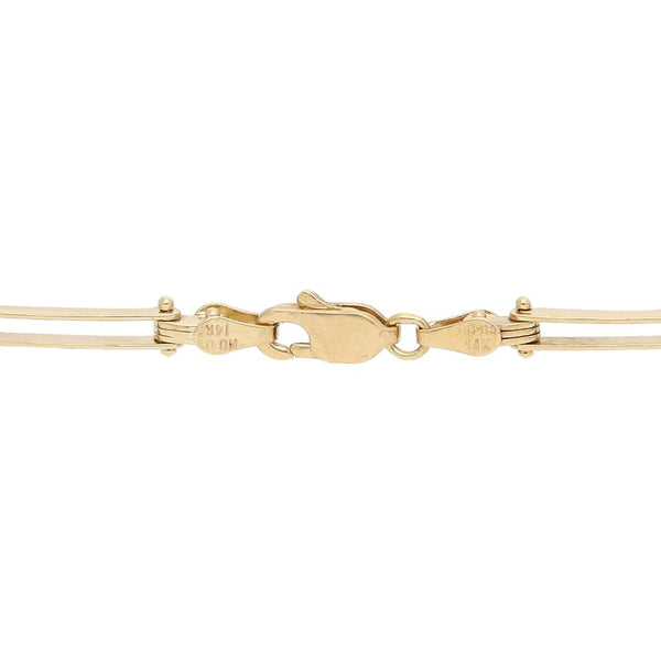 Pulsera eslabón articulado con perlas en oro amarillo 14 kilates.
