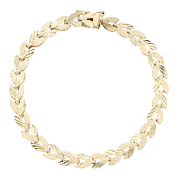 Pulsera eslabón articulado motivo hojas en oro amarillo 14 kilates.