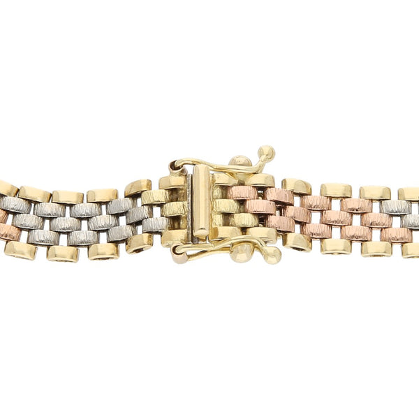 Pulsera eslabón articulado en oro tres tonos 14 kilates.