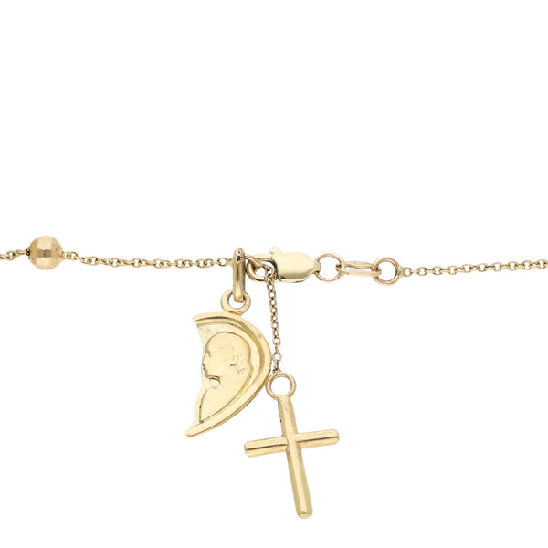 Pulsera de eslabón cruzado con aplicaciones motivos religiosos en oro amarillo 14 kilates.