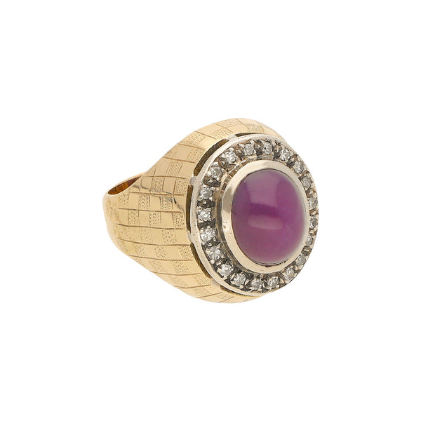 Anillo diseño especial con diamantes y rubí estrella en oro dos tonos 14 kilates.