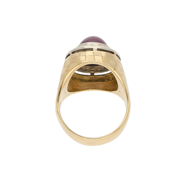 Anillo diseño especial con diamantes y rubí estrella en oro dos tonos 14 kilates.