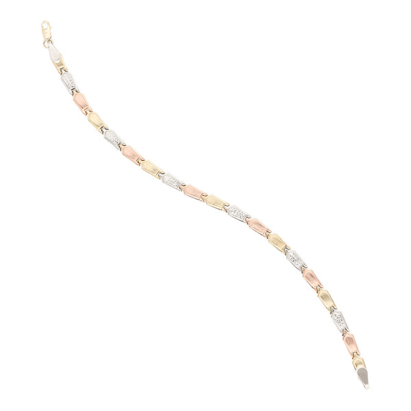 Pulsera eslabón articulado en oro tres tonos 14 kilates.