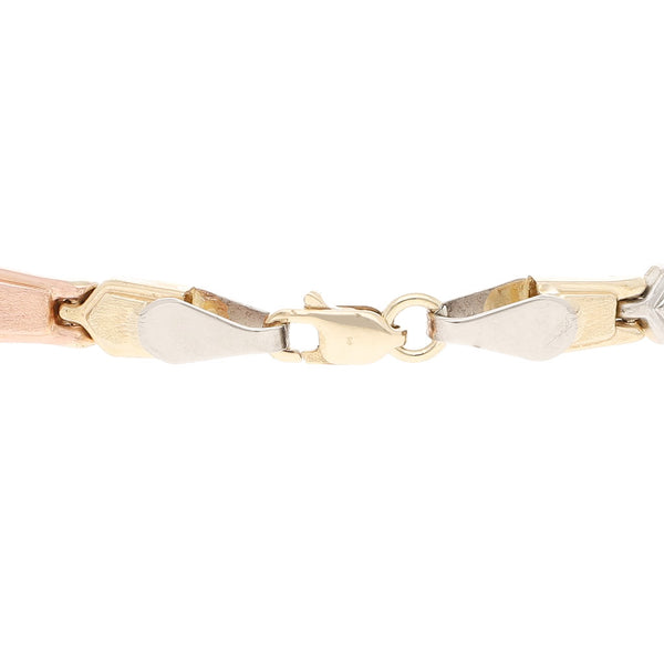 Pulsera eslabón articulado en oro tres tonos 14 kilates.