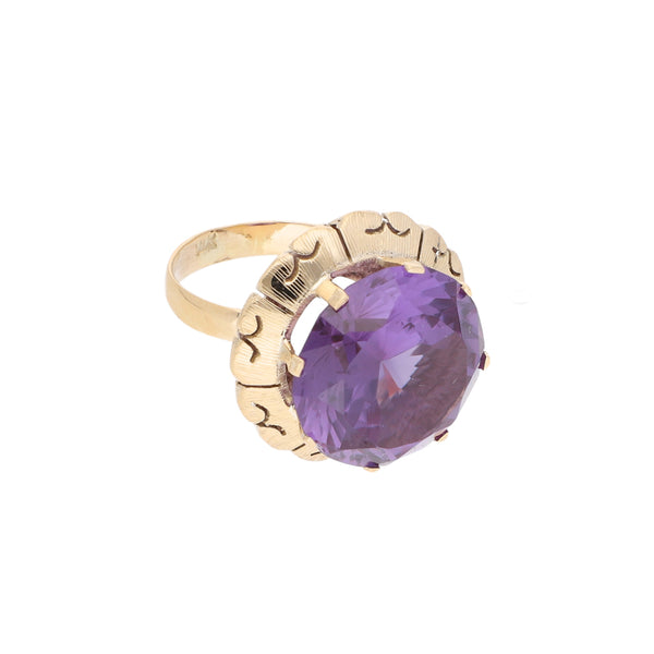 Anillo diseño especial con sintético en oro amarillo 12 kilates.