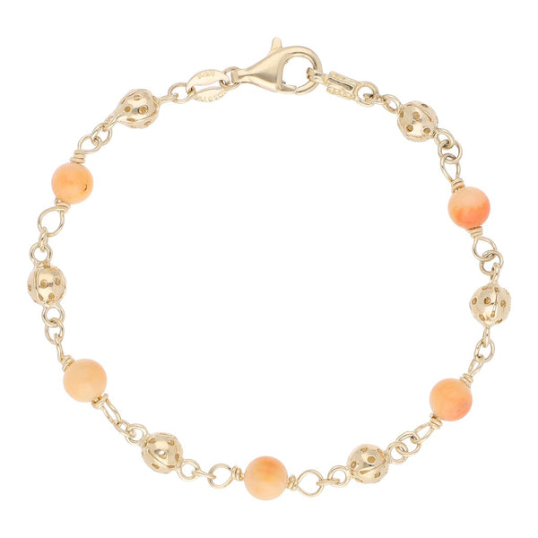 Pulsera eslabón articulado con aplicaciones de coral en oro amarillo 14 kilates.