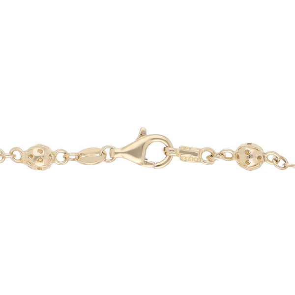 Pulsera eslabón articulado con aplicaciones de coral en oro amarillo 14 kilates.